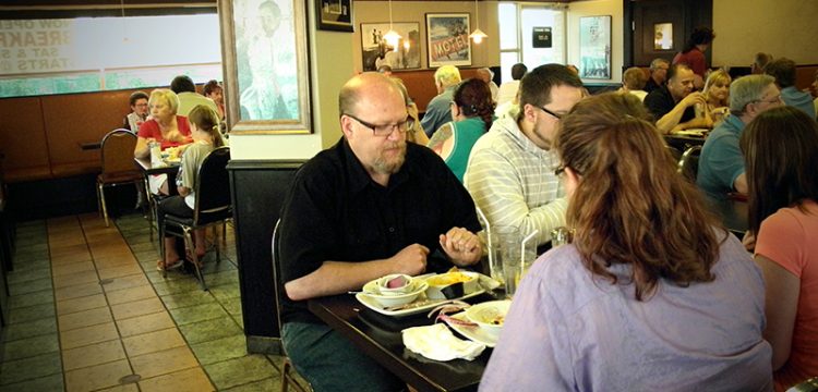 A family eating happily at Michigan Diner.